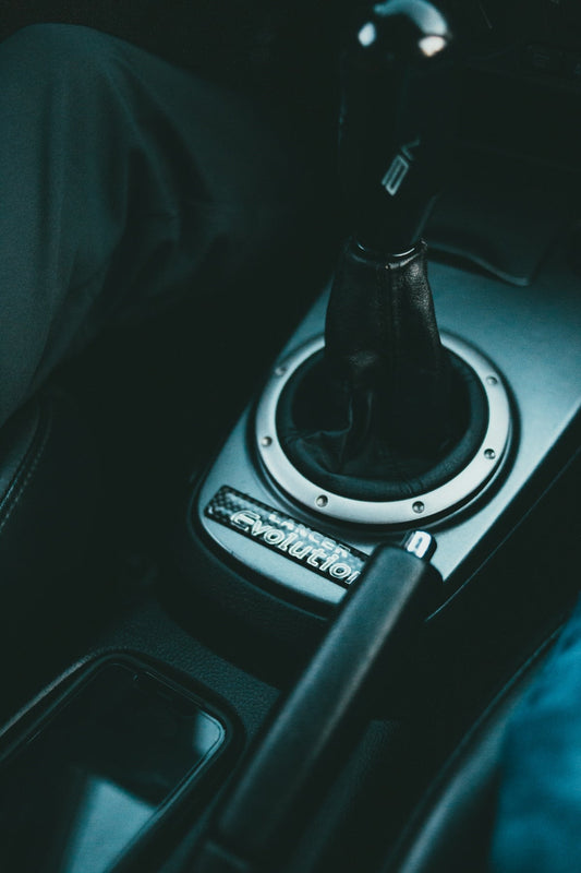 black and silver automatic gear shift lever