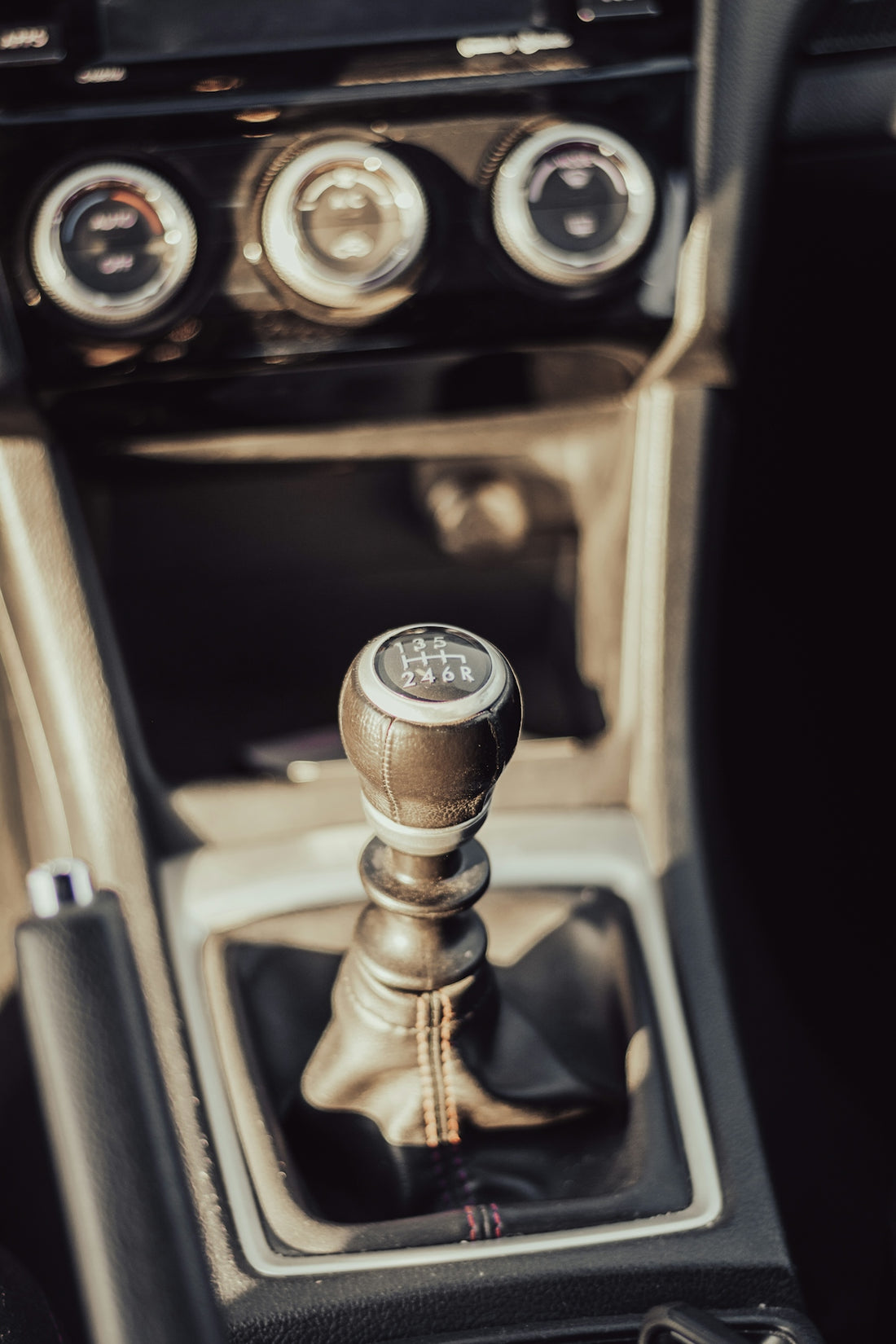 a close up of a car's gear stick