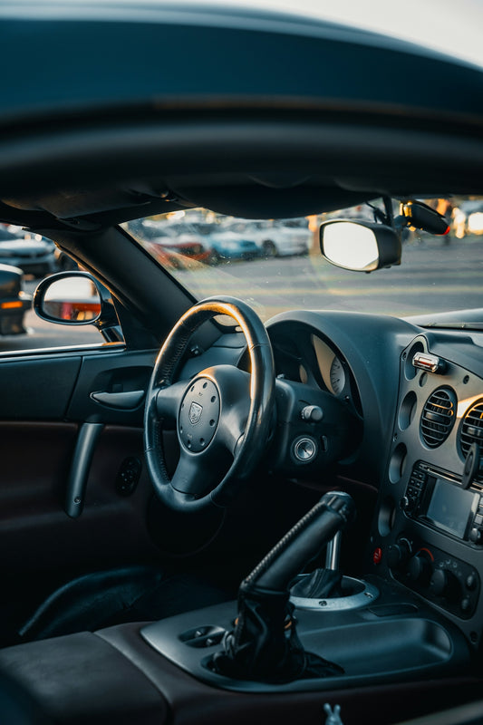 A view of a car dashboard from the driver's seat