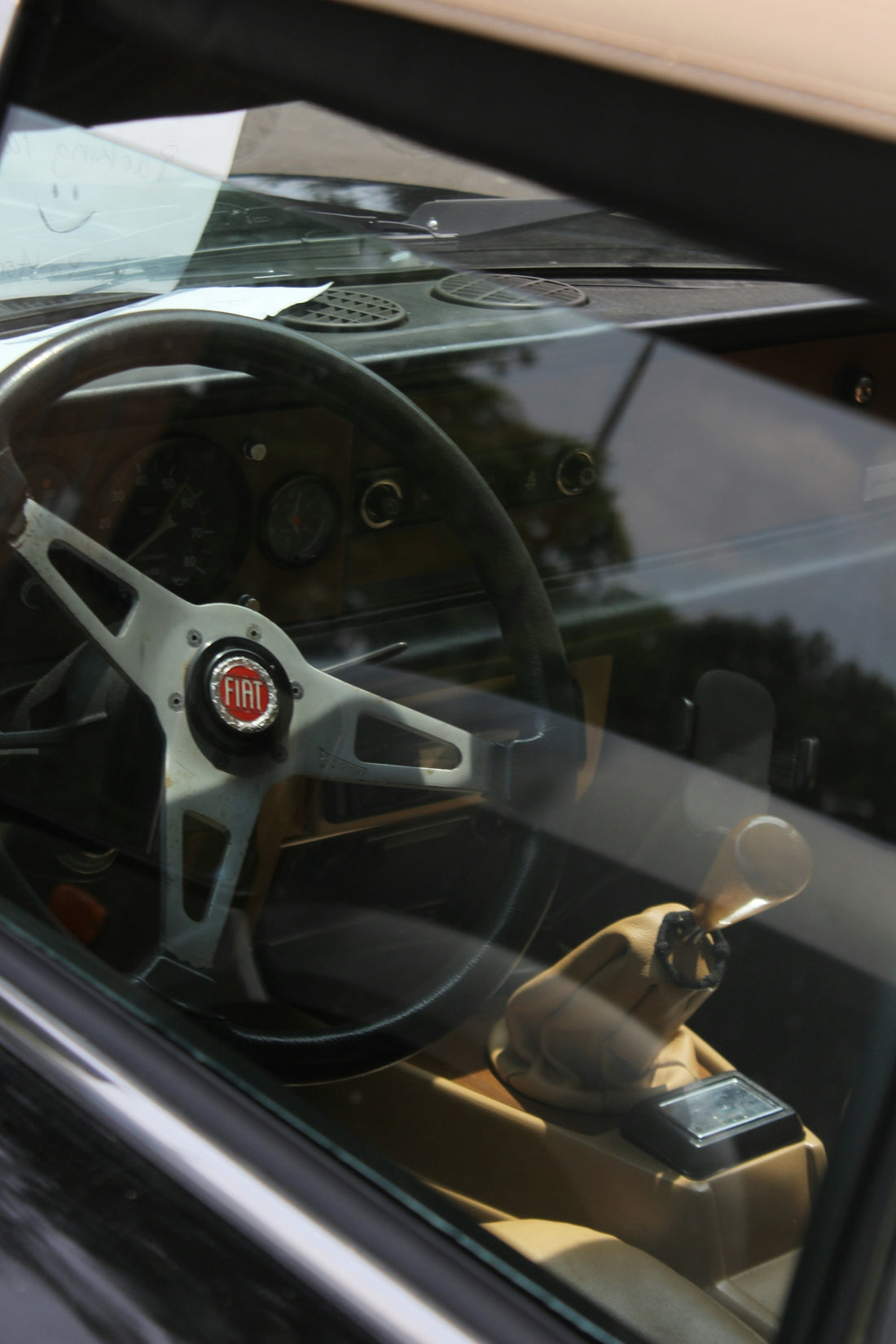 Inside view of a classic fiat car's interior.